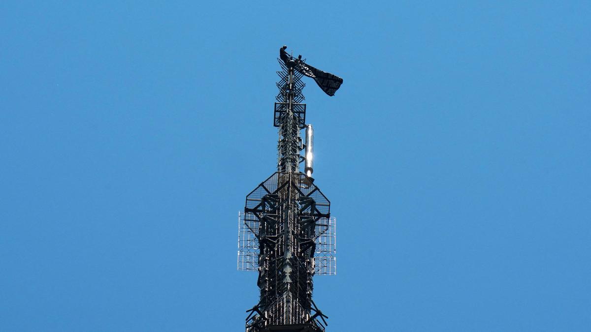 Two people hang banner about ‘the power of love’ on Empire State Building antenna