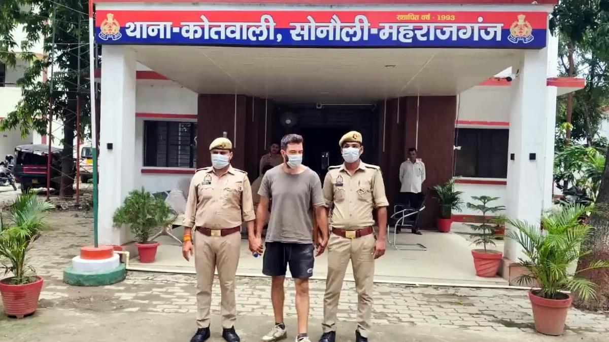 U.S. national held at Nepal border giving contradictory accounts, say officials