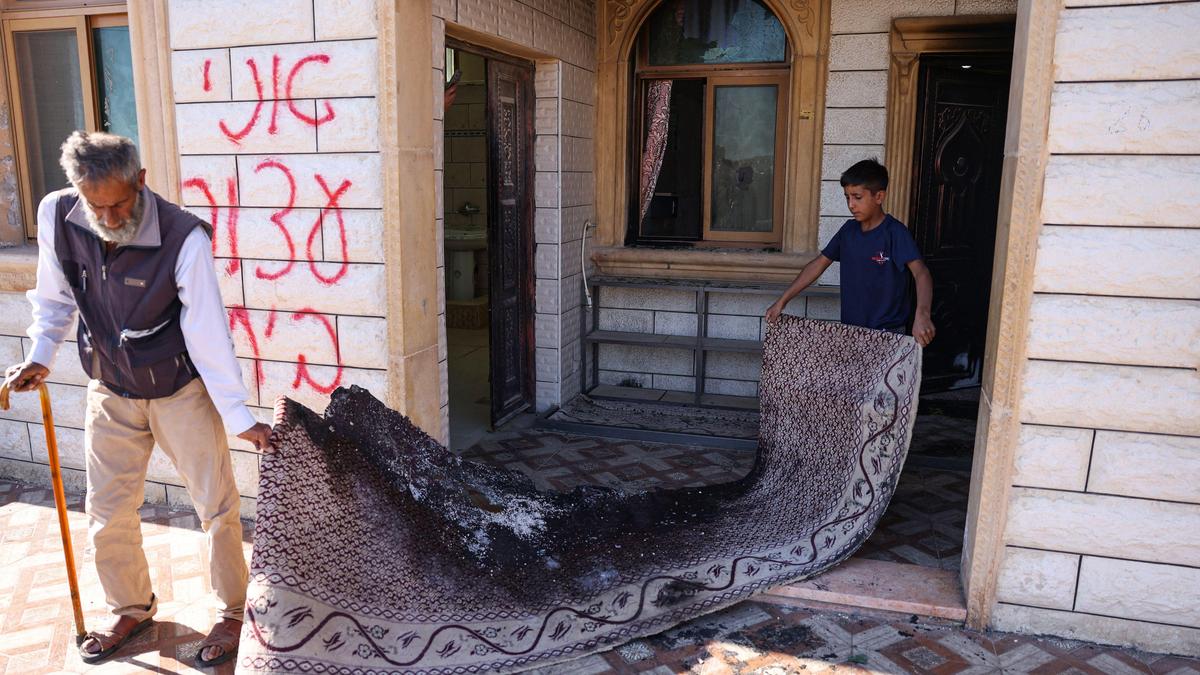 Palestinians say Israeli settlers torch mosque, factory