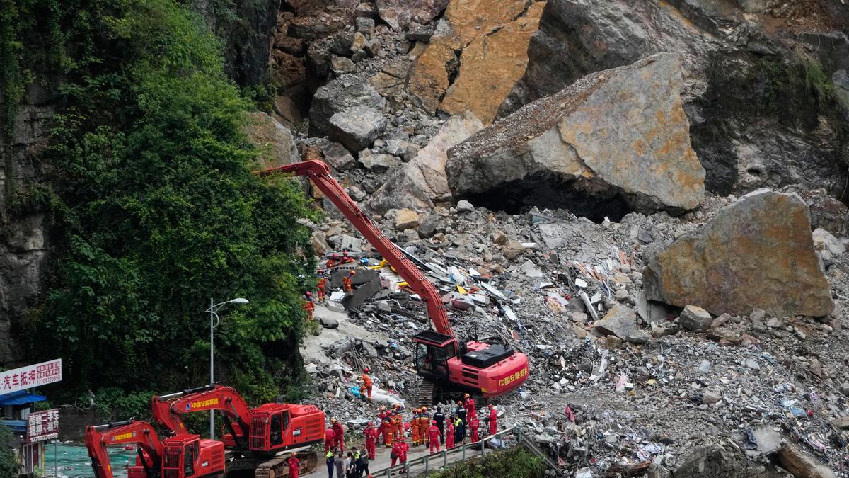 Rescuers race to find survivors in rain after landslip in China kills at least eight