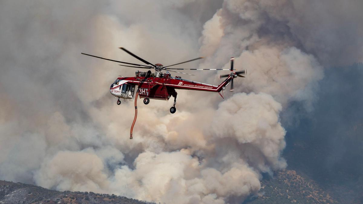 Dangerous wildfire keeps crews from reaching helicopter crash in Utah